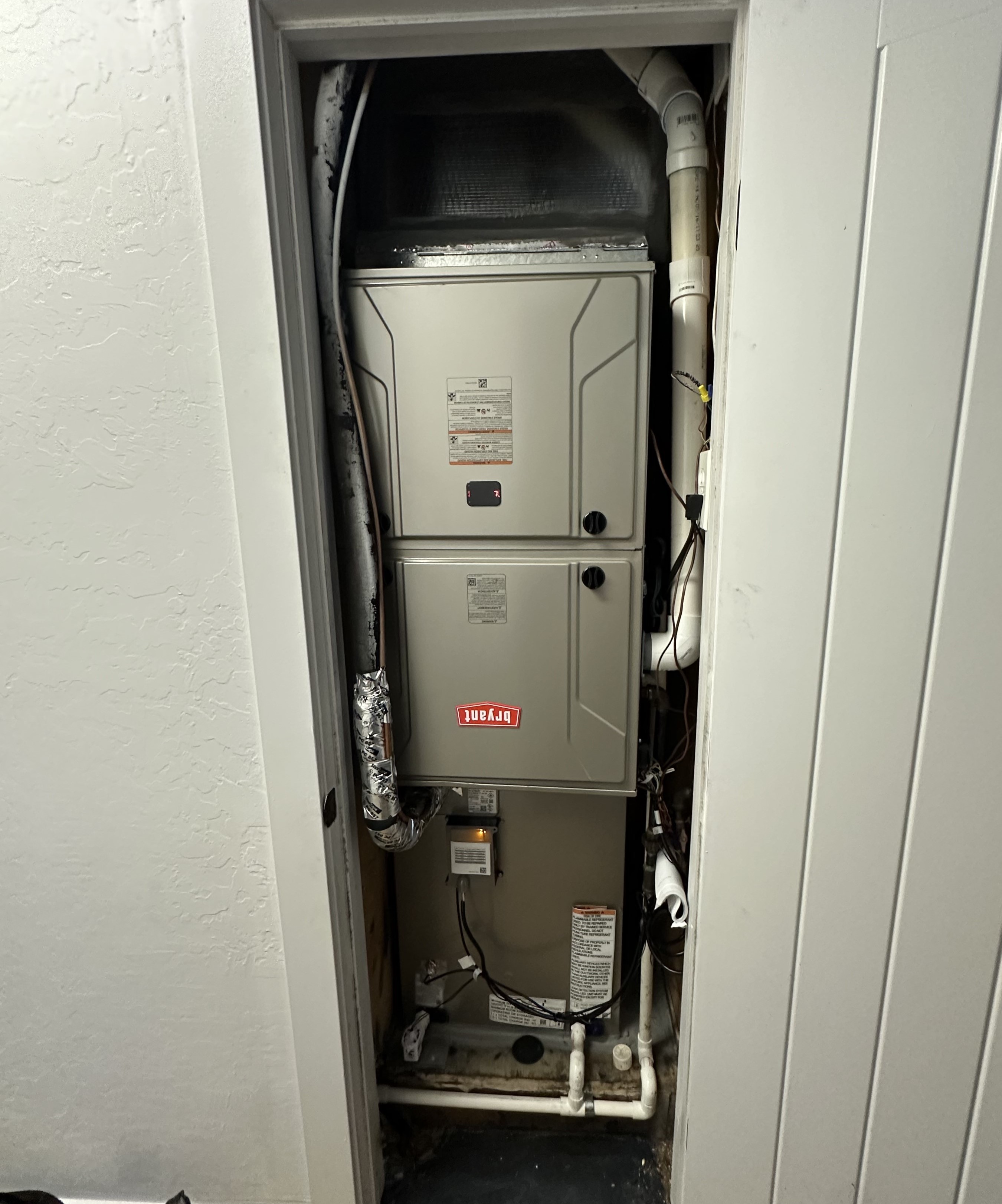 Wall-mounted split air conditioner in a modern interior, actively cooling the room with fresh airflow.